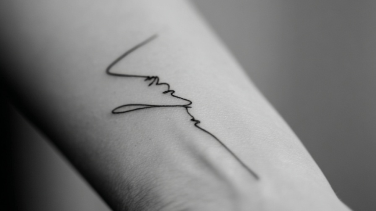 Marking the Bond: 15 Elegant Name Tattoos That Stand the Test of Time